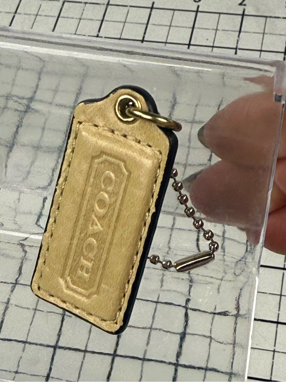 Coach two tone embossed gold front & metallic Leather back hang tag Key w Chain